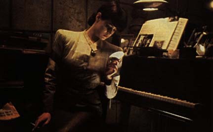 Rachael looking at Deckard's pictures