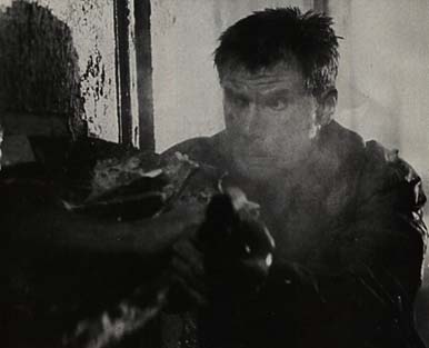 Roy grabs Deckard's gun